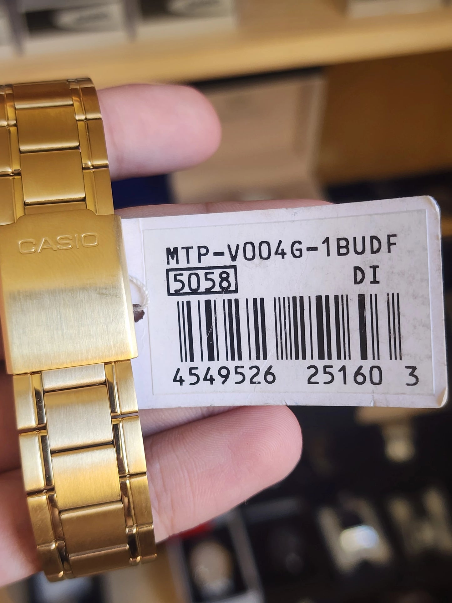 Casio mtp v004 gold black dial