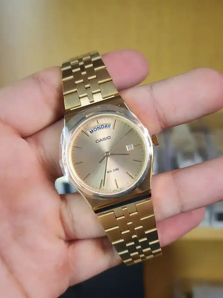 Casio mtp b146 gold daydate