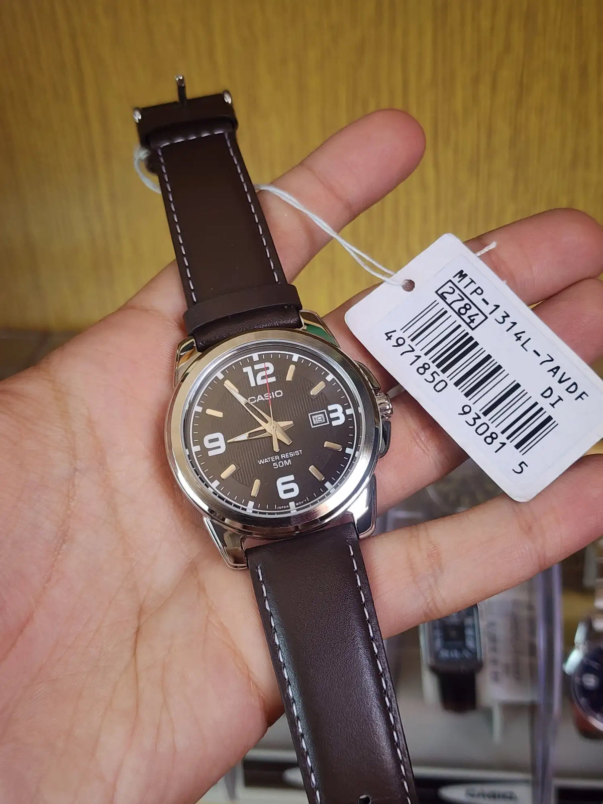 Casio MTP 1314 brown leather black dial