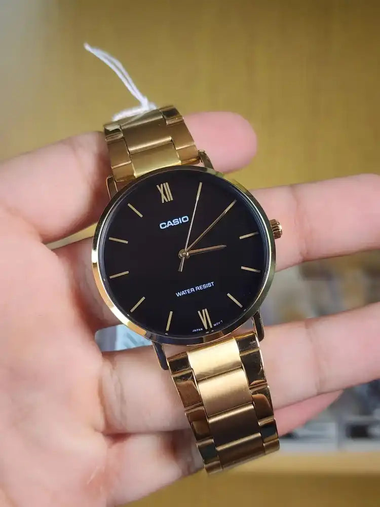 Casio mtp VT01 gold black dial
