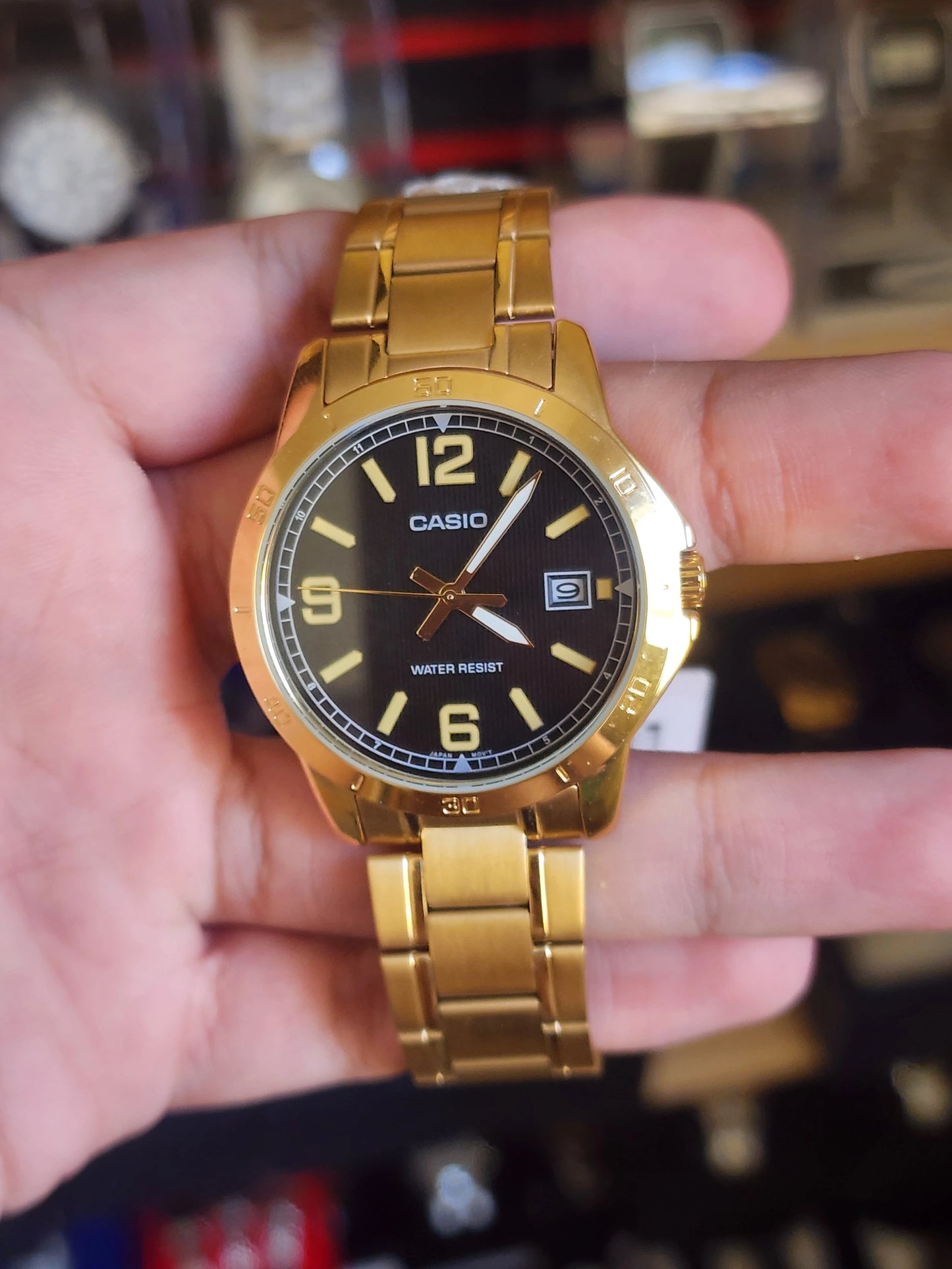 Casio mtp v004 gold black dial