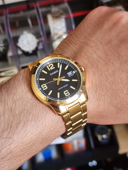 Casio mtp v004 gold black dial