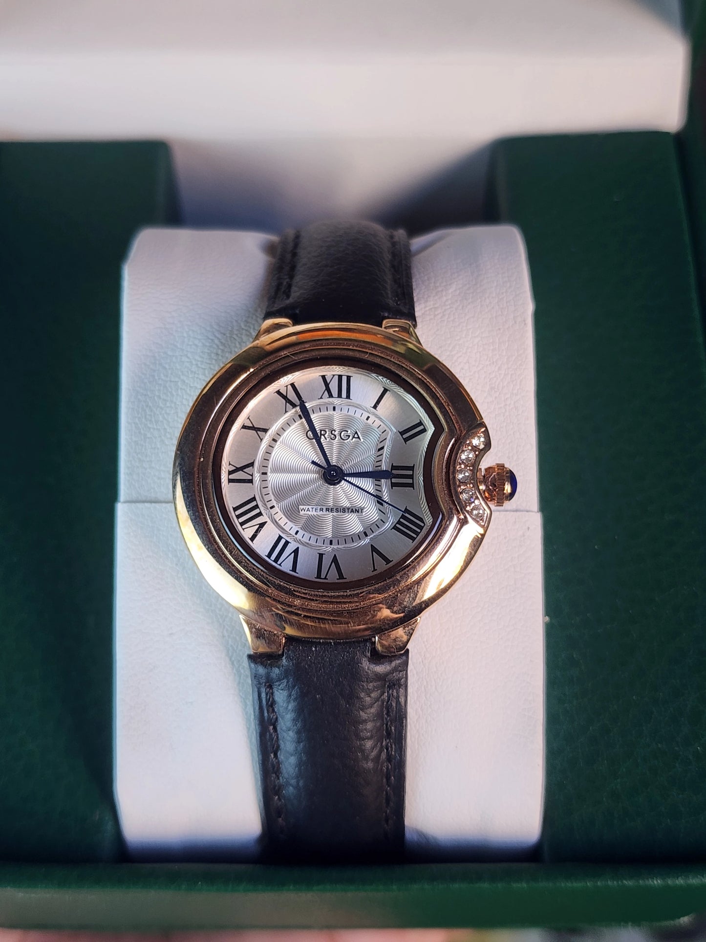ORSGA women round black leather bronze bezel