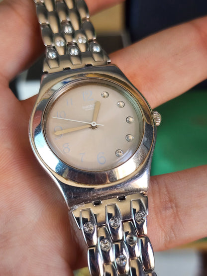 Swatch women half diamond dial