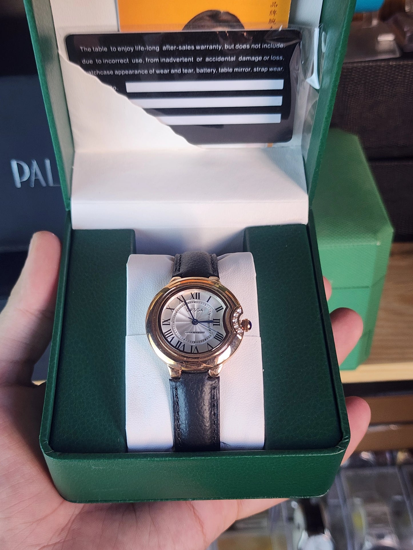 ORSGA women round black leather bronze bezel