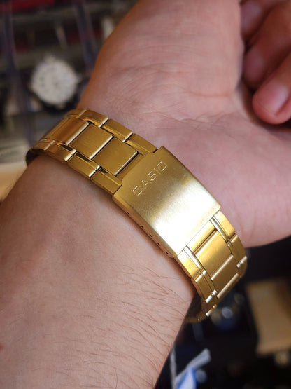 Casio mtp v004 gold black dial