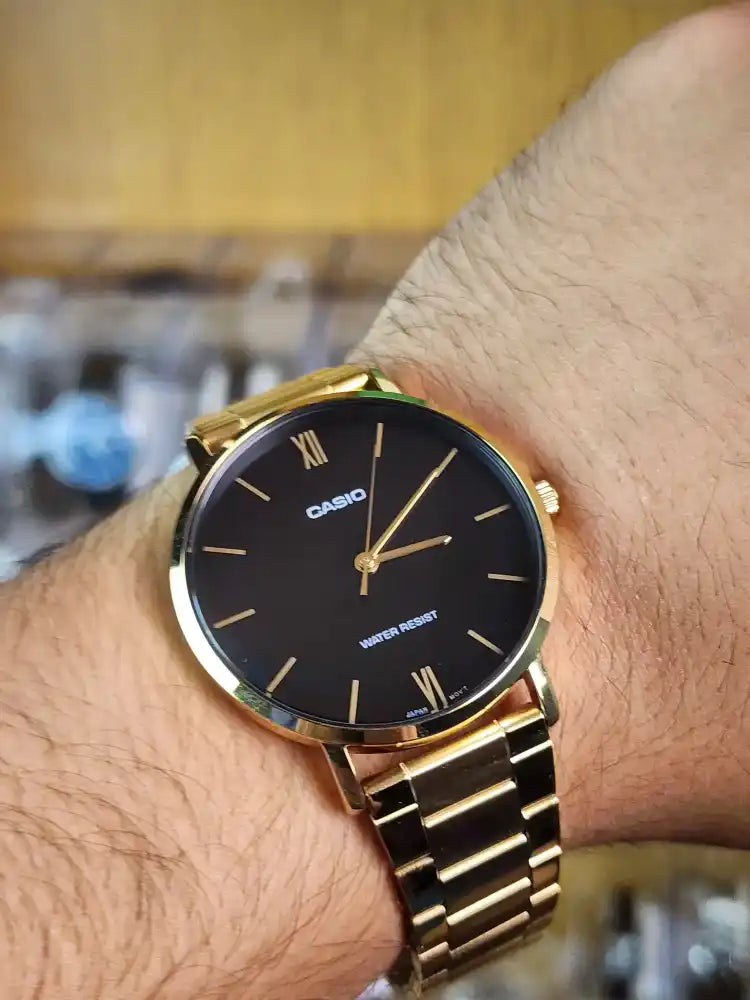 Casio mtp VT01 gold black dial