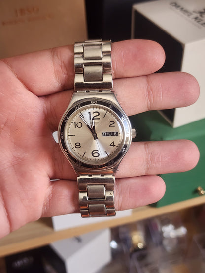 Swatch beige dial black circle
